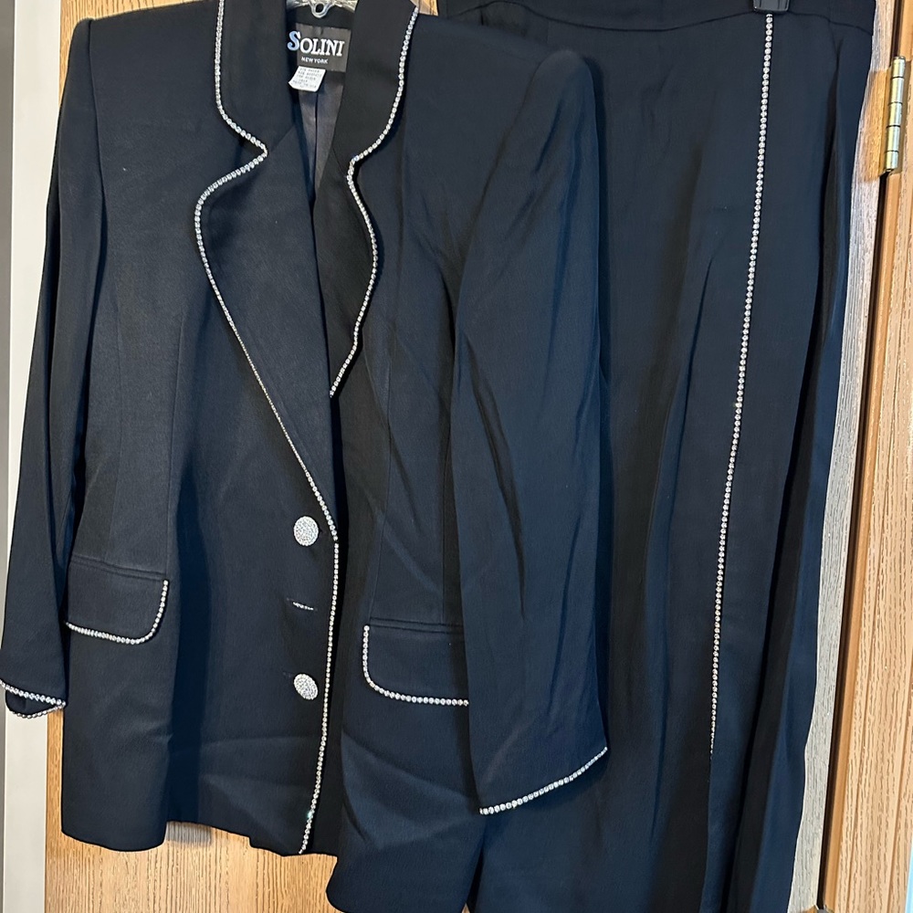 60 %Rayon/40 acetate Black two piece suit size 12 by Solini excellent condition.